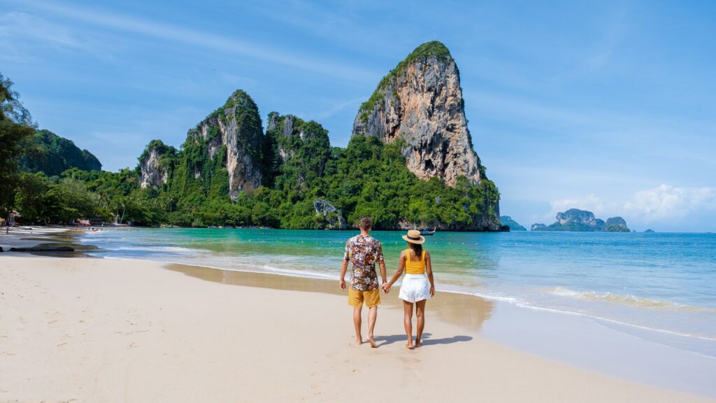 Image of couple walking by the beach in Thailand