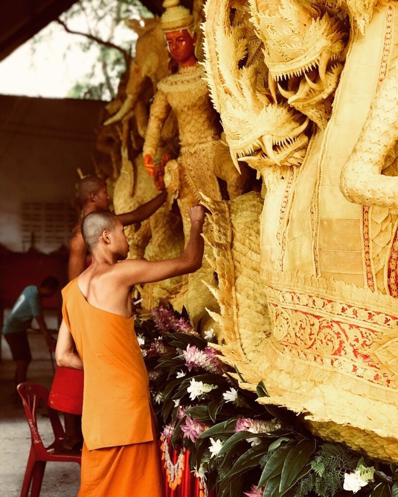 image of people painting statue