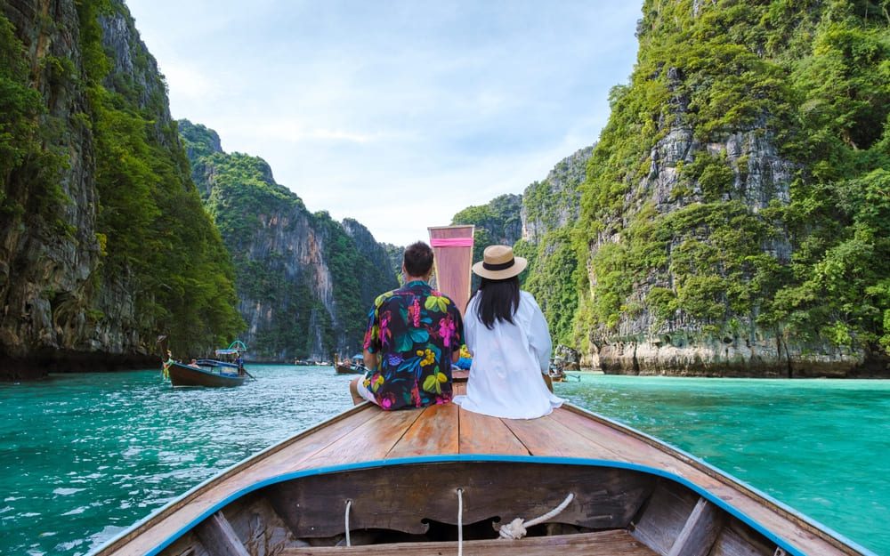 Couple on Longtail Boat in the Phi Phi Islands | Thailand Insider